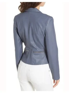 Close-up of a women's leather outerwear piece with intricate zipper details and a premium sheepskin leather texture.