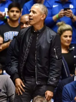 Barack Obama wearing a black bomber jacket men with '44' on the sleeve. This celebrity inspired bomber jacket is a perfect smart casual mens jacket and a modern politician style jacket.
