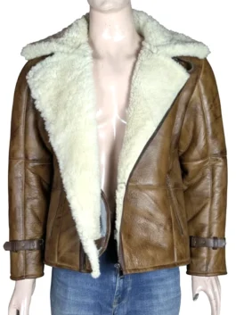 Close-up of a distressed brown leather jacket highlighting the sheepskin material and faux fur lining.