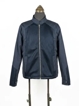 Front view of the screen-accurate Steve Rogers navy blue mesh-panel jacket on a mannequin, highlighting the central silver zipper and stand-up collar.