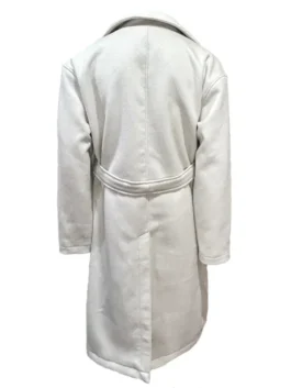 Rear view of the Christmas coat women Charity Jones wears, highlighting the structured shoulders and elegant drape of this holiday outerwear piece.