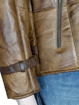 A man’s brown distressed leather jacket with a thick white faux fur shearling collar and zipper closure.