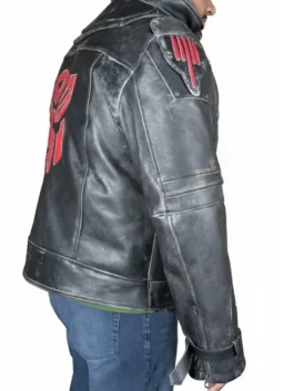 Right profile view of the black distressed armor leather jacket, highlighting the large red embroidered logo emblem on the back and matching red shoulder armor accent.