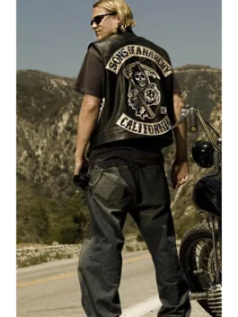 Jax Teller sons of anarchy vest on the actor, featuring the Reaper, SOA top rocker, and California bottom rocker on a black leather cut.