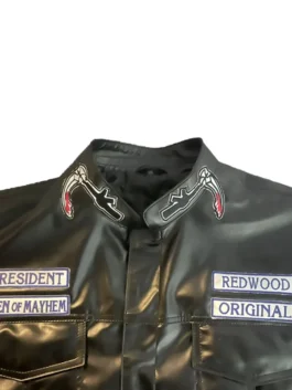 Top half of a sons of anarchy leather coat showing President, Redwood Original, and small Reaper collar patches. soa leather vest