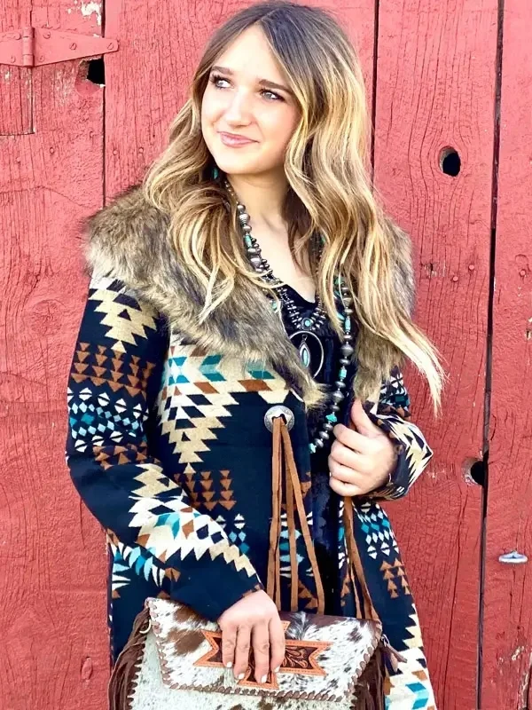Women's long tribal print coat with faux fur collar and fringe details