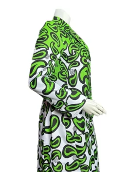 Lily Collins as Emily Cooper wearing a long white and green abstract print coat in Emily in Paris Season 3.