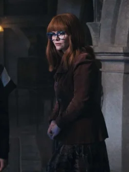 Sophisticated dark brown blazer featuring a rounded collar and structural puffed shoulders