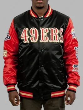 Black and red varsity jacket with embroidered championship patches on sleeves