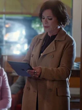 Detailed front view of the double-breasted So Help Me Todd Margaret Brown Coat featuring classic button closures.