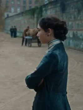 Front view of The Law According to Lidia Poet Leather Coat with structured puff shoulders.