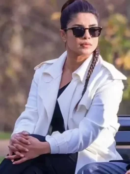 A full-length view of a tailored women's coat with wide lapels and buttoned cuffs.