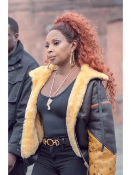 Mary J. Blige wearing the Power Book 2 Ghost Shearling Leather Jacket. This shot highlights Monet Tejada's signature winter shearling coat, showcasing the plush yellow lining and leather details from the Power Book II Ghost wardrobe.