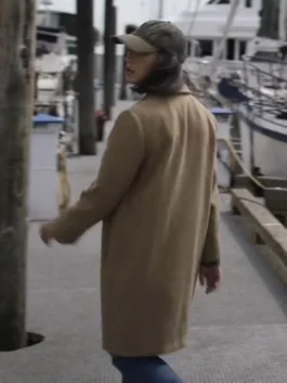 Detailed shot of the structured shoulders and mid-length silhouette on The Night Agent 2023 Luciane Buchanan Coat.