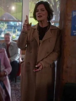 A professional woman wearing the So Help Me Todd Margaret Brown Coat with a wide lapel collar.