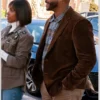 A man wearing the Howard Gordon blazer from The Curse of Bridge Hollow over a plaid shirt.