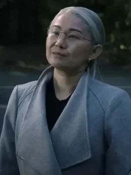 Women's elegant grey wool coat with a wide notched lapel and structured shoulders.