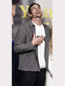 Ashton Kutcher wearing the Your Place or Mine Grey Jacket over a white graphic tee.