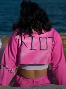 Heartbreak High Amerie Wadia Pink Jacket close-up back view, featuring the hand-painted "RIOT" text and distressed cropped hem.