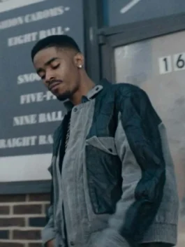 Detailed view of a high-quality two-tone suede jacket featuring a professional patchwork design and relaxed fit.