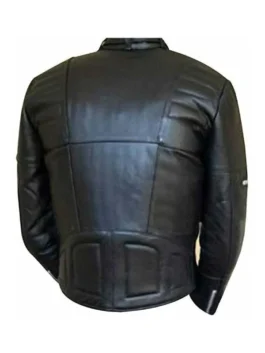 Close-up of a structured black motorcycle jacket with quilted shoulders and asymmetrical zip closure.