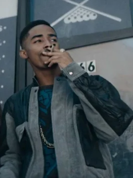 Men's grey and black multi-paneled suede leather jacket with large utility pockets and a structured collar.