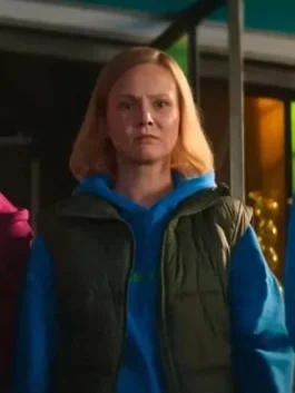 A man wearing a black puffer jacket with a brown corduroy collar and shoulder panels, styled as a casual winter outerwear piece.