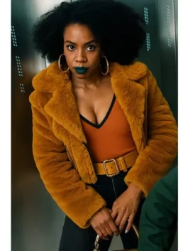 A woman wearing a vibrant mustard yellow vegan fur shearling jacket with a wide lapel collar and an open-style front over a burnt orange top.