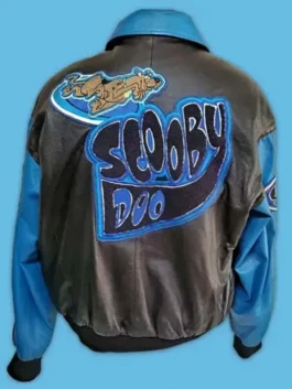 Back view of a vintage Scooby Doo leather jacket in black and blue featuring a large embroidered character patch and stylized logo across the shoulders.