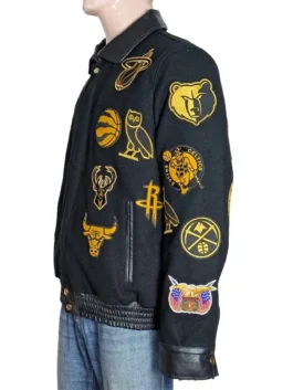 Front view of a black and gold wool jacket with stand-up collar.