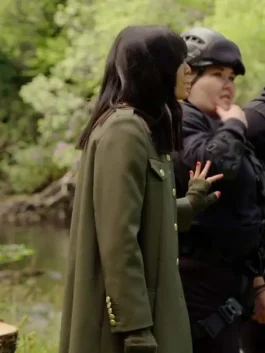 The Traitors Claudia Winkleman Green Coat side pose