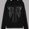 Black zip-up hoodie featuring a sparkling rhinestone skeleton ribcage design.