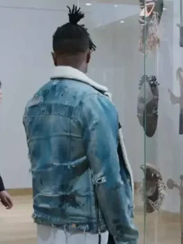 Back view of Killmonger's jean jacket from Black Panther, showing the distressed blue denim and white shearling lining.