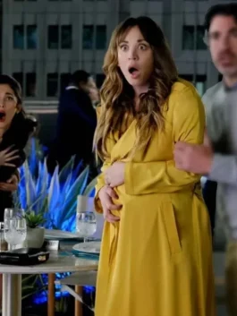 Women's long yellow cotton trench coat with wide lapels and open front design.