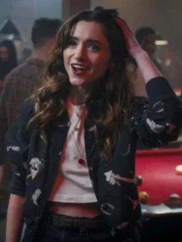 Natalia Dyer pink satin bomber jacket from Based on a True Story with green and white striped cuffs.