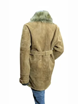 A side-back profile of the Emmanuelle Chriqui Lana Lang coat showing the adjustable belted strap, soft suede texture, and elegant grey fur trim.