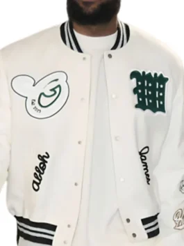Stylish off-white and green men's varsity jacket with snap-button front and classic athletic patches.
