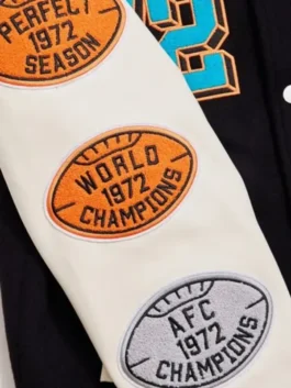 Detailed view of a retro-style sports jacket with commemorative football patches.