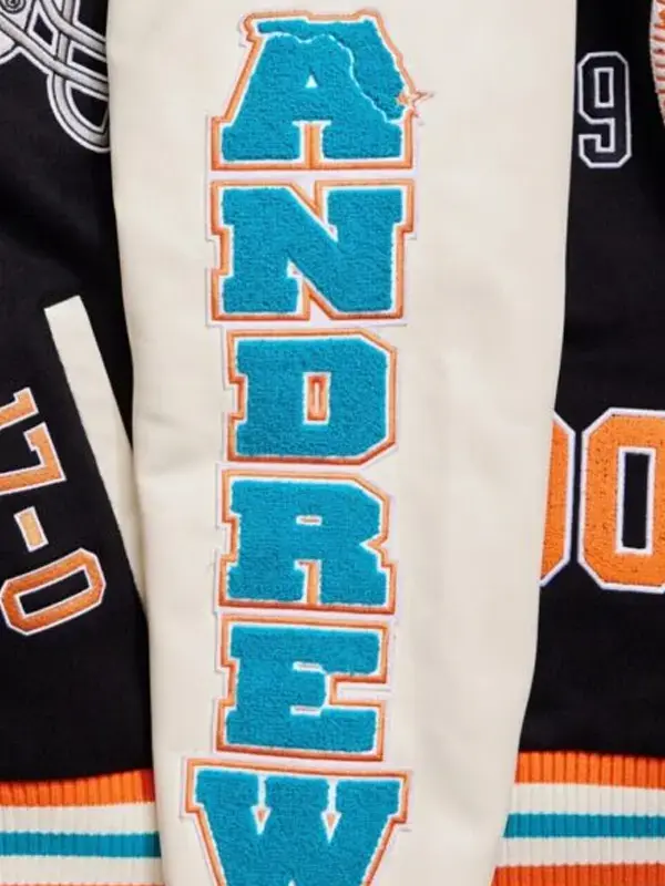 Athletic style outerwear with orange and teal striped hem and cuff details.