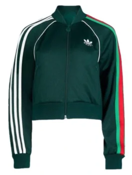 Women's dark green bomber-style athletic jacket with white sleeve stripes and a red and green stripe accent, inspired by Mélanie Laurent.