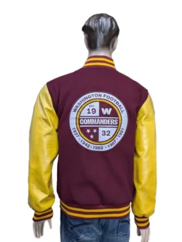 A detailed look at the back of a varsity jacket with rib-knitted hem and professional embroidery for the Washington Commanders.