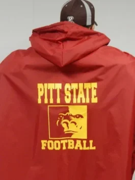 NFL football player sideline cape coat, back view of a red hooded cloak worn for pro game day.