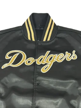 A styling shot showing the full look of the black and gold LA Dodgers jacket from America Jackets.