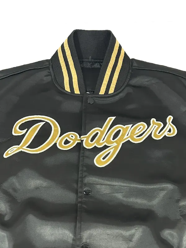 A styling shot showing the full look of the black and gold LA Dodgers jacket from America Jackets.