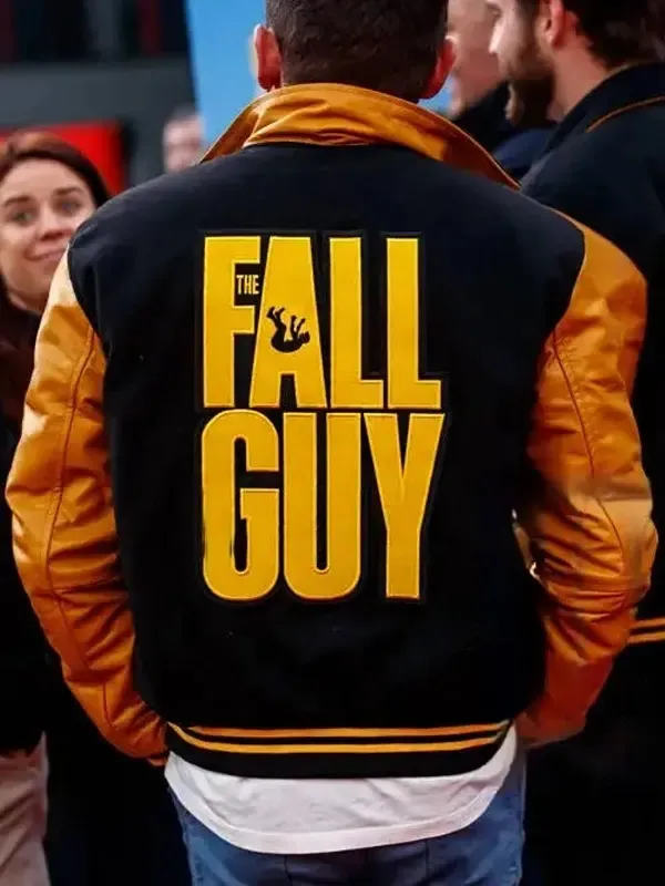 Back view of the Ryan Gosling Fall Guy jacket, a black and yellow letterman jacket featuring a large "FALL GUY" logo and stuntman graphic.