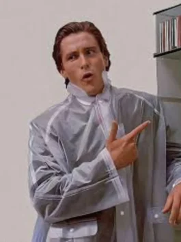 Transparent clear vinyl trench coat, long length, structured collar, inspired by the 80s executive style.