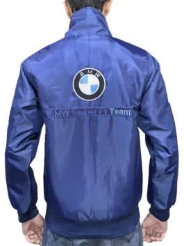Back view of a navy blue BMW F1 Petronas Sauber Vintage Racing Jacket featuring a large BMW logo and BMW Sauber F1 Team embroidery on the back.