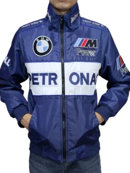 A man wearing a BMW Sauber F1 x Petronas Racing Jacket with Credit Suisse shoulder details and BMW Petronas M Power F1 Sauber Team Dell branding.