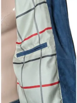 A blue leather bomber jacket partially open to reveal a classic red and tan checkered interior lining.