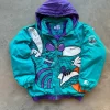 Front view of NBA All Star Game Vintage 90’s Charlotte Hornets Jacket in teal and purple design, showcasing bold Hornets logo, classic Charlotte Hornets Jacket for basketball fans.